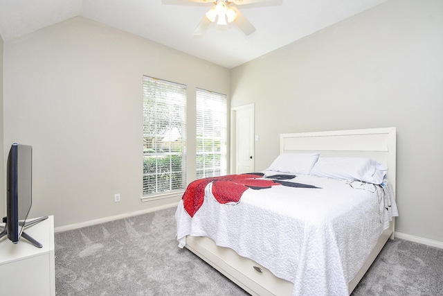 carpeted bedroom with ceiling fan, lofted ceiling, and baseboards