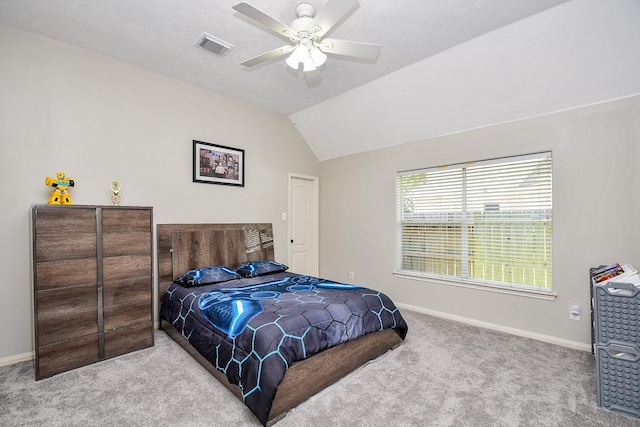 bedroom featuring visible vents, a ceiling fan, carpet flooring, vaulted ceiling, and baseboards