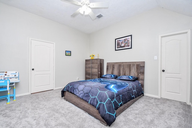 carpeted bedroom with lofted ceiling, ceiling fan, visible vents, and baseboards