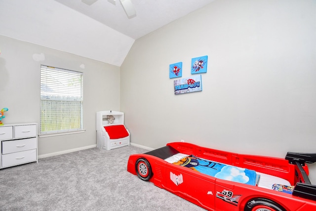 bedroom with carpet floors, lofted ceiling, ceiling fan, and baseboards