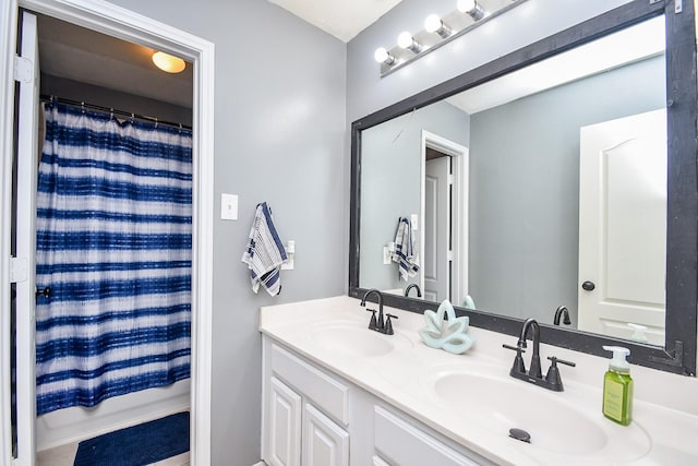 bathroom with a sink and double vanity