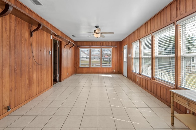 unfurnished sunroom featuring ceiling fan and visible vents