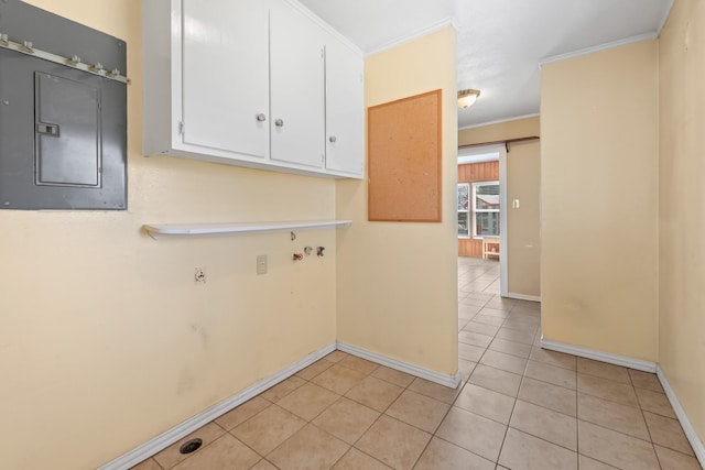 laundry room with light tile patterned floors, hookup for a washing machine, cabinet space, ornamental molding, and electric panel