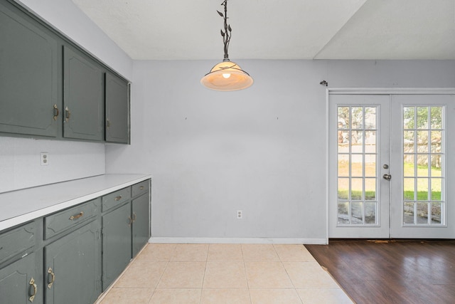 kitchen featuring a wealth of natural light, pendant lighting, and light countertops