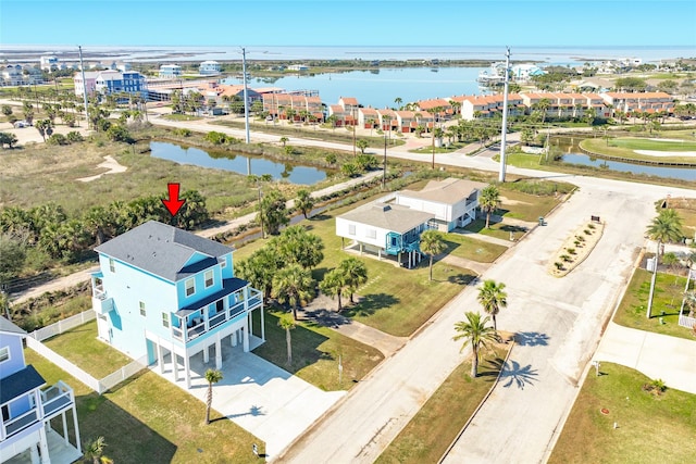 birds eye view of property featuring a water view