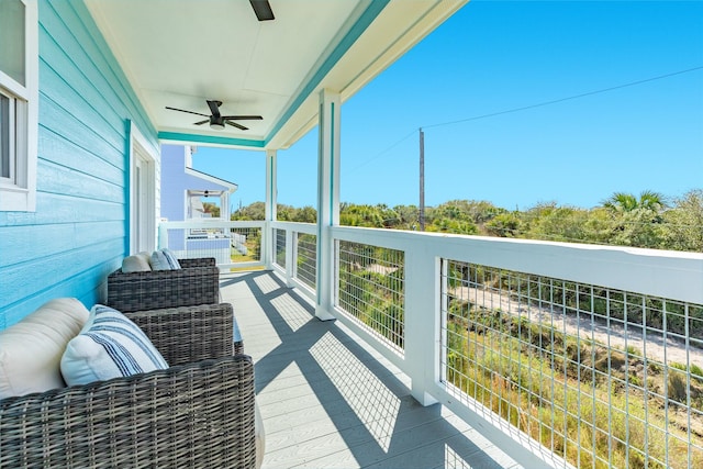 balcony featuring ceiling fan and a sunroom