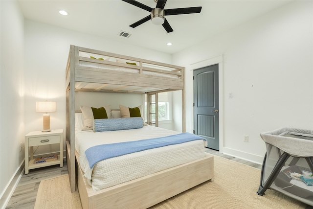 bedroom featuring baseboards, visible vents, a ceiling fan, light wood-style floors, and recessed lighting