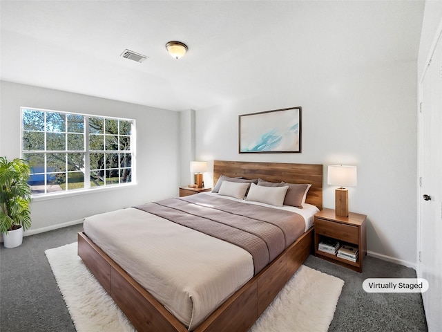 bedroom featuring carpet, visible vents, and baseboards