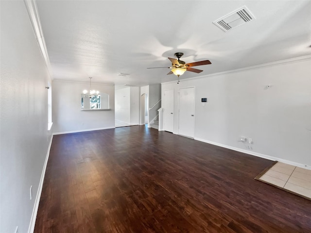 unfurnished living room with dark wood-style floors, ornamental molding, ceiling fan with notable chandelier, and visible vents