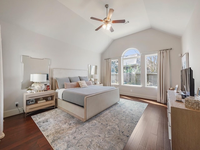 bedroom with a ceiling fan, lofted ceiling, dark wood-style flooring, and baseboards