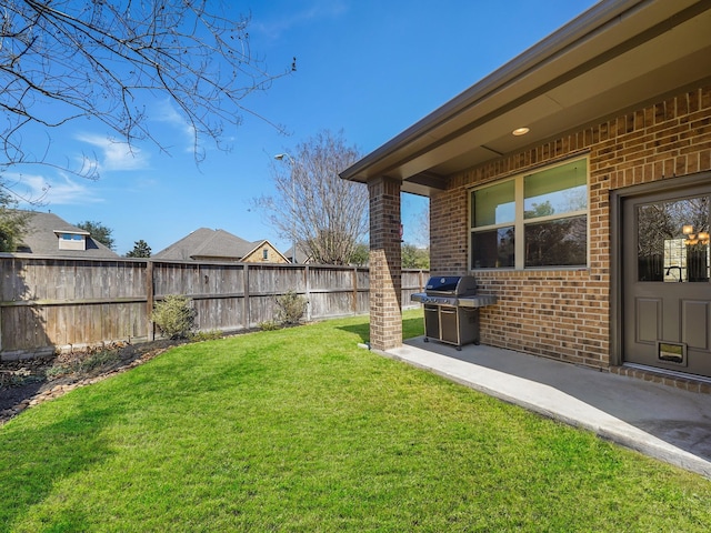 view of yard featuring a patio and fence