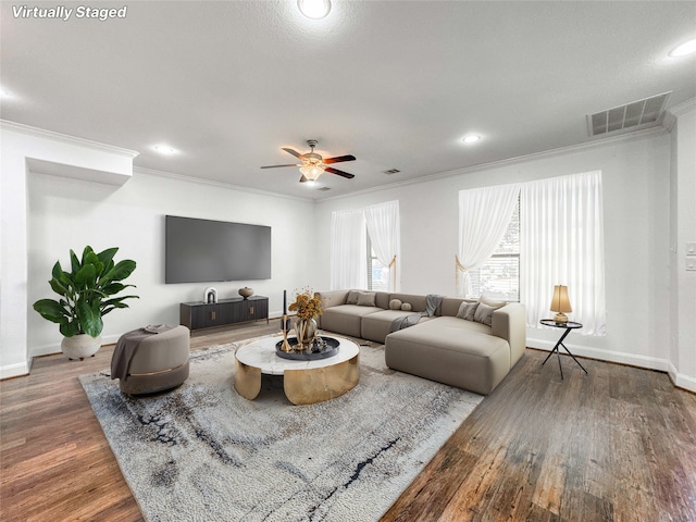 717 Via Lago, Webster, TX 77598 - living area featuring ornamental molding, wood finished floors, recessed lighting, a ceiling fan, and baseboards