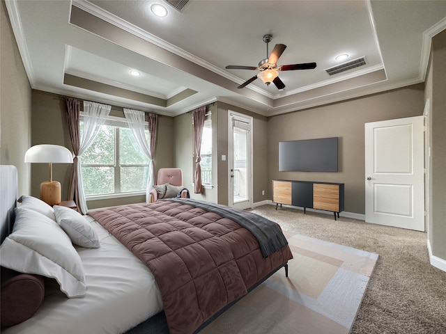 717 Via Lago, Webster, TX 77598 - bedroom featuring crown molding, light colored carpet, baseboards, a tray ceiling, and ceiling fan