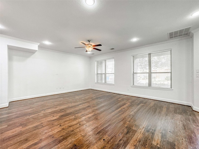717 Via Lago, Webster, TX 77598 - spare room featuring crown molding, dark wood finished floors, ceiling fan, recessed lighting, and baseboards