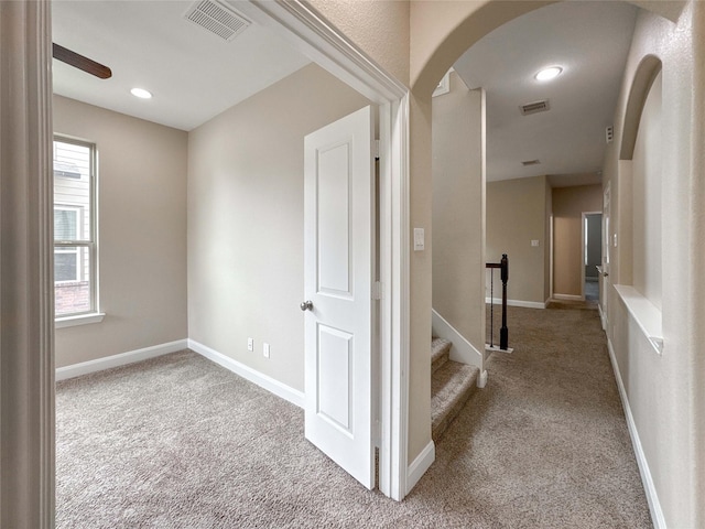 717 Via Lago, Webster, TX 77598 - corridor with carpet flooring, arched walkways, and baseboards