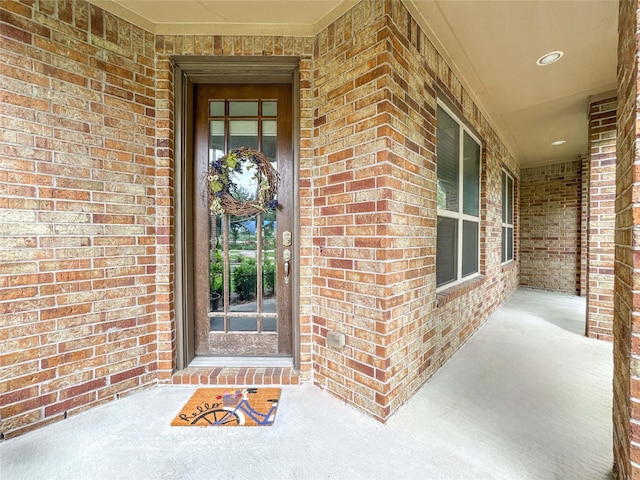 717 Via Lago, Webster, TX 77598 - view of exterior entry with brick siding and covered porch