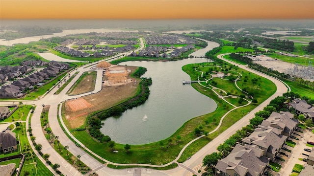 717 Via Lago, Webster, TX 77598 - aerial view at dusk of a water view and a residential view
