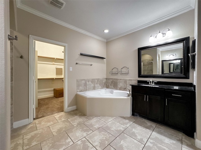 717 Via Lago, Webster, TX 77598 - bathroom with crown molding, vanity, a bath, a walk in closet, and baseboards