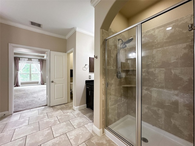 717 Via Lago, Webster, TX 77598 - bathroom with ornamental molding, a shower stall, baseboards, vanity, and tile patterned floors