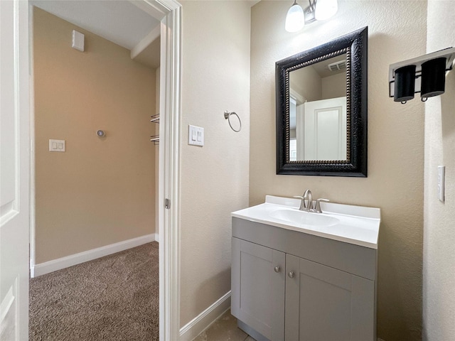 717 Via Lago, Webster, TX 77598 - bathroom with vanity and baseboards