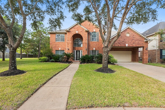 traditional home with driveway, brick siding, a front lawn, and an attached garage