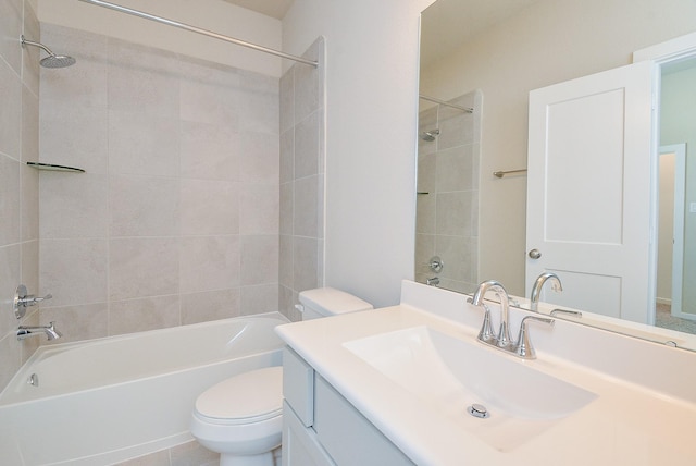 bathroom with shower / tub combination, vanity, and toilet