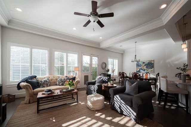 living area with ornamental molding, recessed lighting, and ceiling fan with notable chandelier