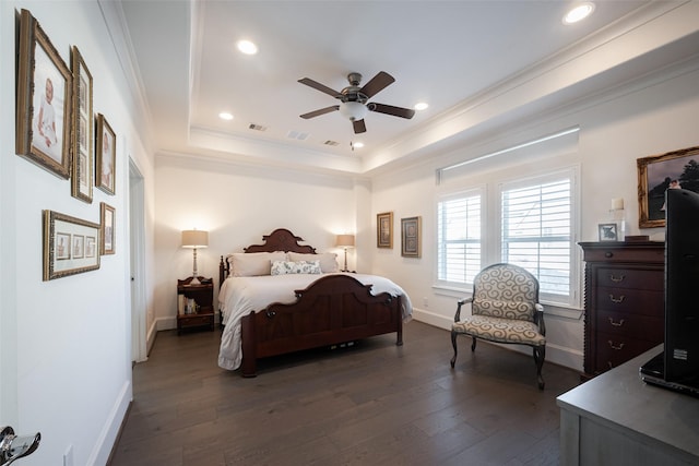 bedroom with baseboards, ornamental molding, dark wood-type flooring, a tray ceiling, and recessed lighting