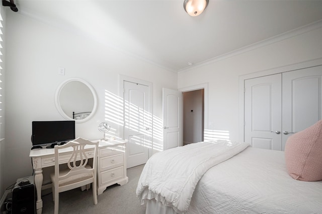 carpeted bedroom with crown molding