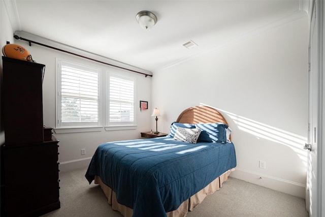 bedroom with light carpet, visible vents, and baseboards