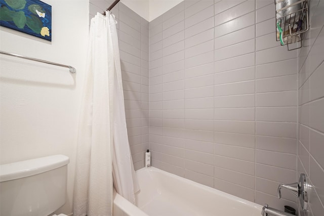 bathroom with toilet and shower / bath combo with shower curtain