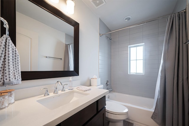 full bath with toilet, visible vents, shower / bath combo with shower curtain, and vanity