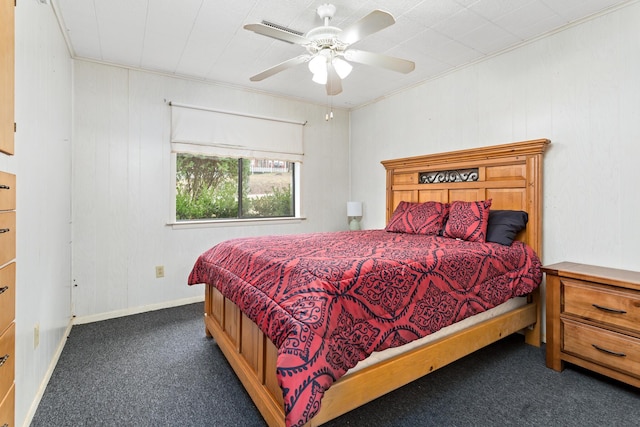 bedroom featuring ceiling fan, dark carpet, and baseboards