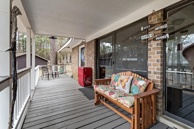 deck with an outdoor structure and a storage unit