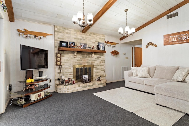 living area featuring vaulted ceiling with beams, visible vents, a brick fireplace, dark carpet, and an inviting chandelier