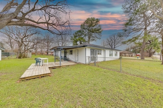 view of yard with fence and a deck