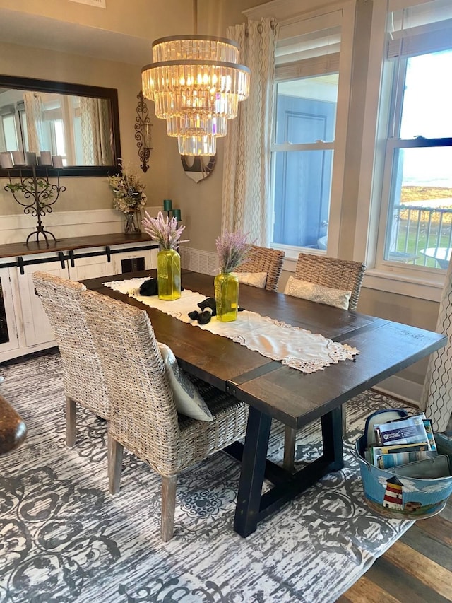 dining room featuring an inviting chandelier and wood finished floors