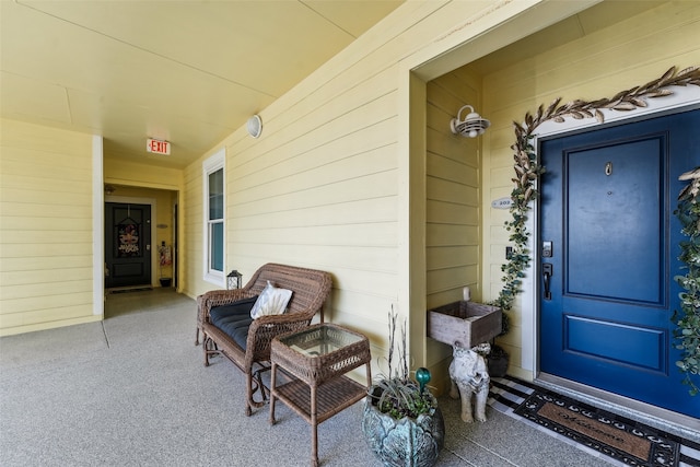 view of exterior entry featuring a porch