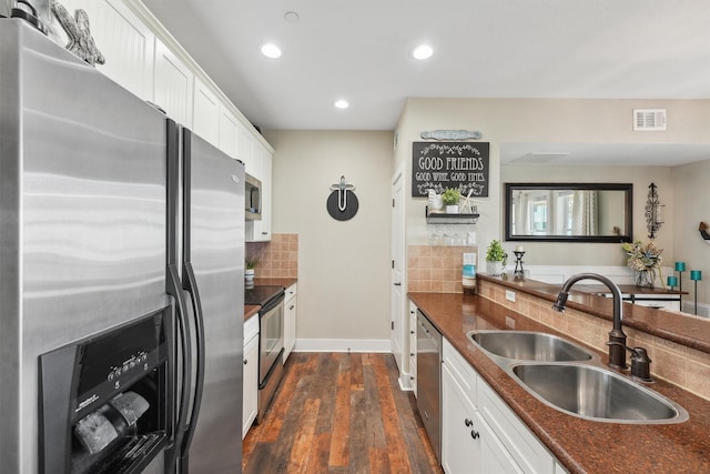 kitchen with dark countertops, visible vents, and appliances with stainless steel finishes