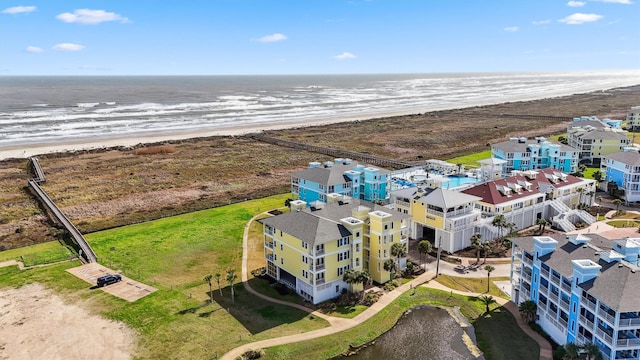 aerial view with a view of the beach and a water view