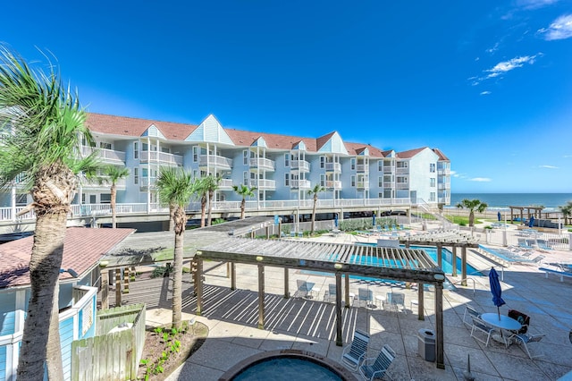 exterior space featuring central AC and a water view