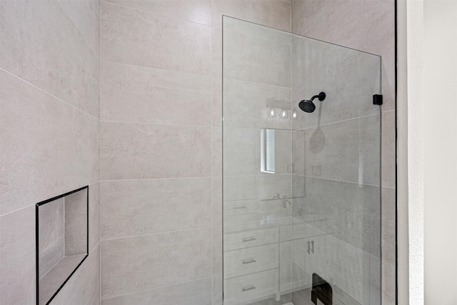 full bathroom with tiled shower