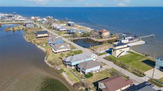 bird's eye view featuring a water view and a residential view