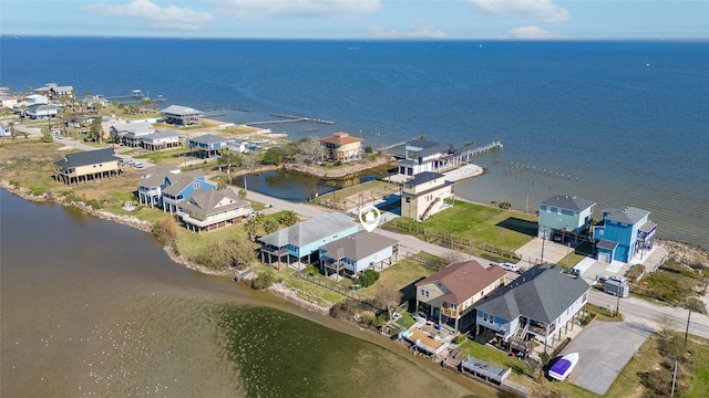 birds eye view of property featuring a water view and a residential view