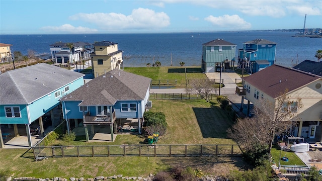 drone / aerial view featuring a residential view and a water view