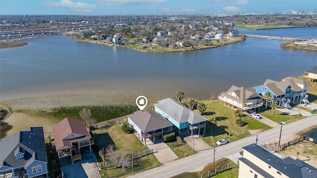 bird's eye view with a residential view and a water view