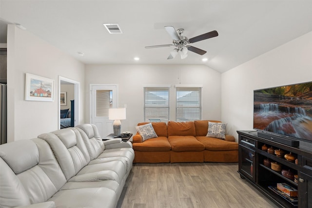 living room with visible vents, a ceiling fan, light wood-style flooring, vaulted ceiling, and recessed lighting