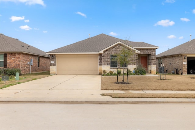 ranch-style home featuring brick siding, central air condition unit, a shingled roof, an attached garage, and driveway