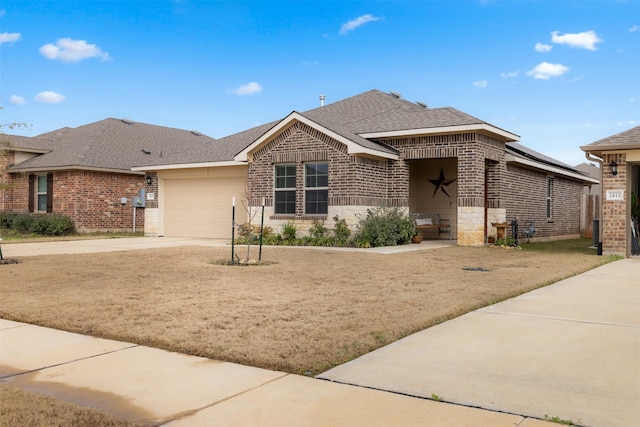 view of front of home with brick siding, a shingled roof, an attached garage, stone siding, and driveway