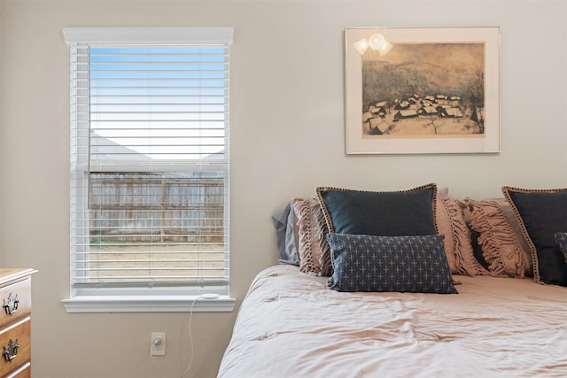 bedroom with multiple windows